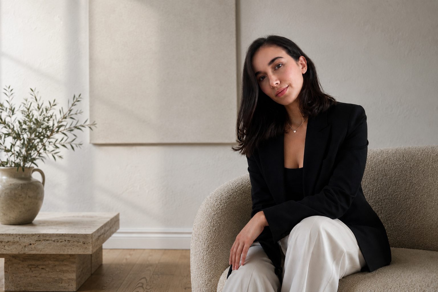 Founder of NF Studio seated in a styled Sydney interior